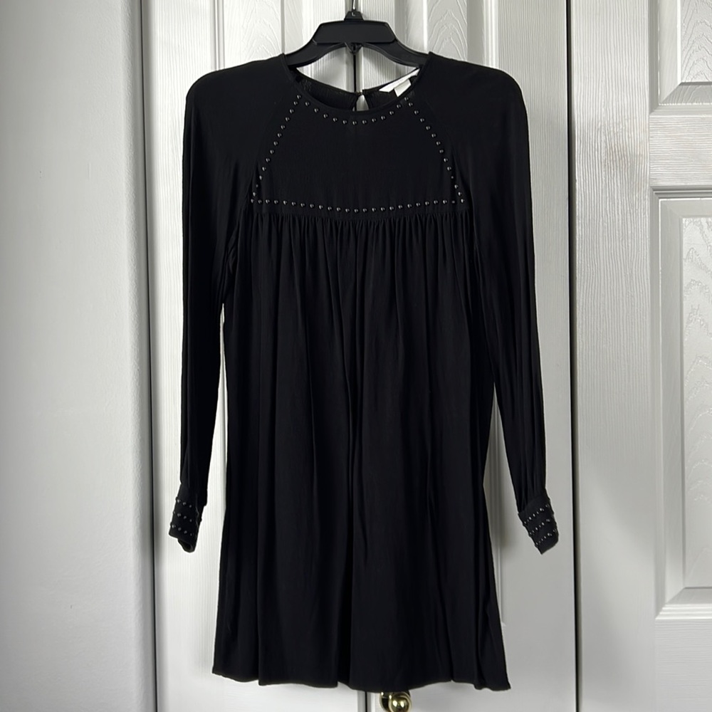 Super cute black dress with beaded detail.